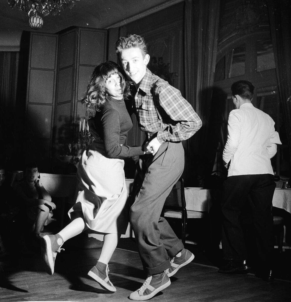 Baseball-booted students jitterbugging at the Carrere night club in Paris.
