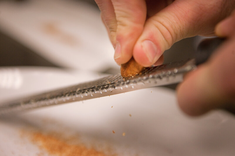 Grate a heavy pinch of nutmeg. Sprinkle it over the spinach as it cooks until wilted.