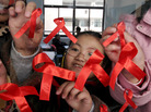 Students paste red ribbons on a window to mark World AIDS Day in Nanjing, China, in 2006. Between 2007 and 2011, the number of newly diagnosed HIV cases in China has nearly quadrupled to 40,000. Students paste red ribbons on a window to mark World AIDS Day in Nanjing, China, in 2006. Between 2007 and 2011, the number of newly diagnosed HIV cases in China has nearly quadrupled to 40,000.