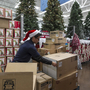 Walmart associate Angel Campos stocks Christmas decorations Wednesday ahead of the pre-Black Friday event at the Wal-Mart Supercenter store in Rosemead, Calif.
