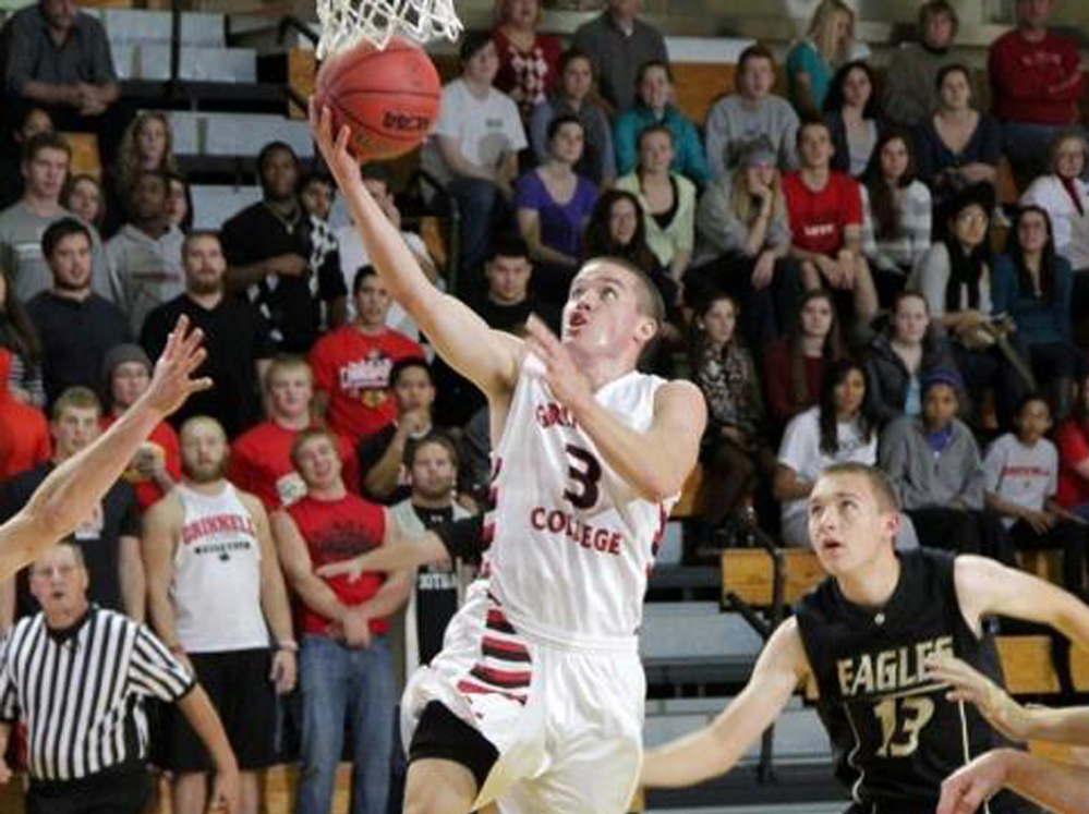 Going for the record: Grinnell College's Jack Taylor during Tuesday night's game, in which he scored 138 points.
