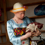 Angel Salvatory, 17, buys cloth at a market in Kabanga village in Tanzania. Albinos living in a nearby protection center are allowed to go to the local market as long as they travel in a group for their own safety.