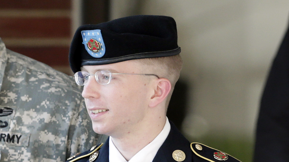 Army Pfc. Bradley Manning is escorted out of a courthouse in Fort Meade, Md., after a pretrial hearing in June. Manning is charged with aiding the enemy by giving hundreds of thousands of classified diplomatic cables and war logs to the secret-sharing website WikiLeaks.