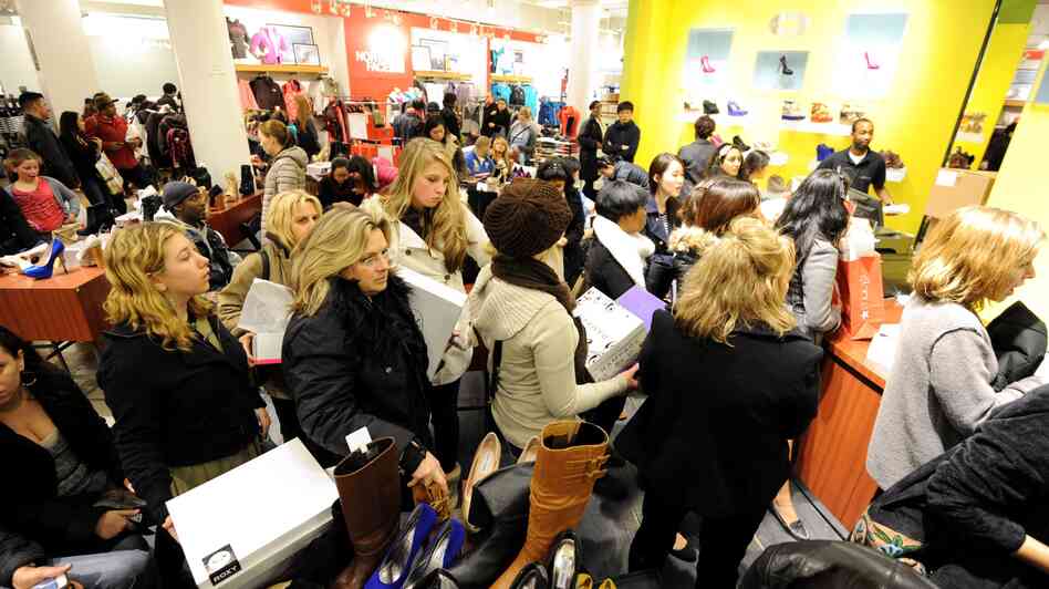 People waited in line to make purchases at a Macy's department store in New York during last year's "Black Friday" shopping weekend.