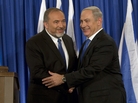 Israeli Prime Minister Benjamin Netanyahu (right) and Foreign Minister Avigdor Lieberman shake hands in front of the media after giving a statement in Jerusalem last month. Netanyahu said his Likud Party will join forces with the hard-line party of his foreign minister in upcoming parliamentary elections. Israeli Prime Minister Benjamin Netanyahu (right) and Foreign Minister Avigdor Lieberman shake hands in front of the media after giving a statement in Jerusalem last month. Netanyahu said his Likud Party will join forces with the hard-line party of his foreign minister in upcoming parliamentary elections.