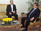 In this image provided by Egyptian President Mohammed Morsi (right), Hamas leader Khaled Mashaal meets with Morsi at the Presidential Palace in Cairo on Sunday. Morsi has won praise for brokering the cease-fire agreement between Hamas and Israel. In this image provided by Egyptian President Mohammed Morsi (right), Hamas leader Khaled Mashaal meets with Morsi at the Presidential Palace in Cairo on Sunday. Morsi has won praise for brokering the cease-fire agreement between Hamas and Israel.