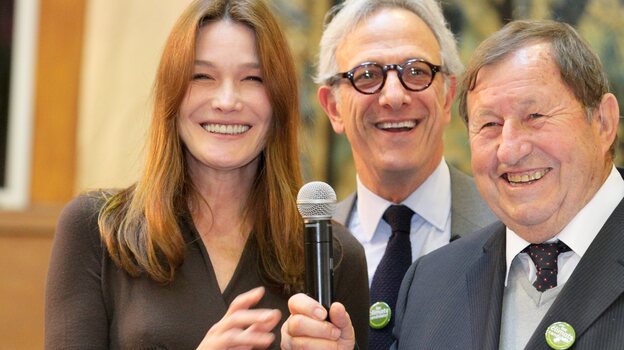 France's former first lady Carla Bruni-Sarkozy, auctioneer Francois de Ricqles and former soccer coach Guy Roux preside over the 152nd Hospices de Beaune wine auction Sunday in Beaune, France. The charity auction raised an all-time high of $7.5 million, which goes to area hospitals.