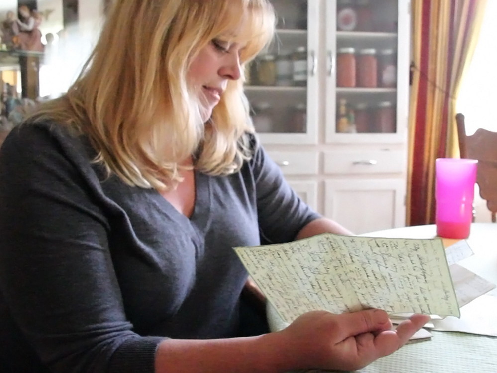 Katheleen Chaney reads one of the love letters she found on the beach near her home in New Jersey after Superstorm Sandy.