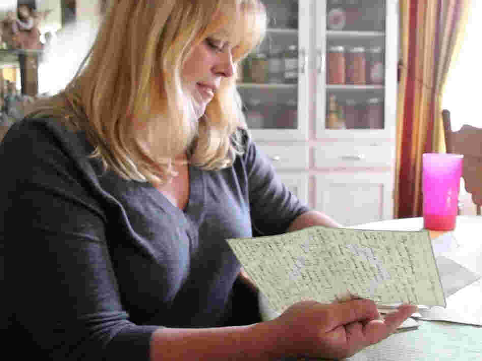 Katheleen Chaney reads one of the love letters she found on the beach near her home in New Jersey after Superstorm Sandy.