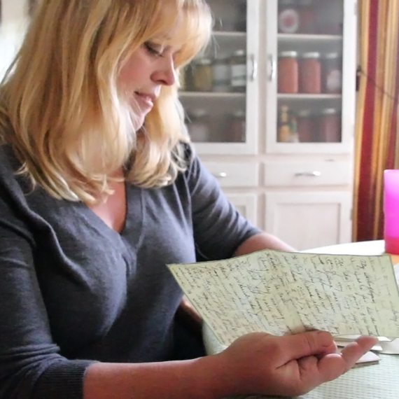 Katheleen Chaney reads one of the love letters she found on the beach near her home in New Jersey after Superstorm Sandy.