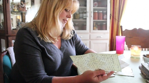 Katheleen Chaney reads one of the love letters she found on the beach near her home in New Jersey after Superstorm Sandy.