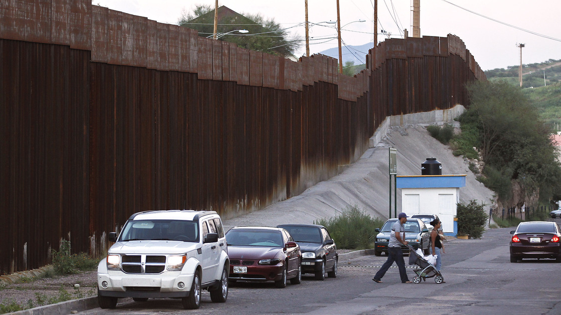 Pedestrians cross the street in Nogales, Mexico, near the border with Arizona. A U.S. Border Patrol agent shot and killed a 16-year-old boy who was throwing rocks near the border fence last month.