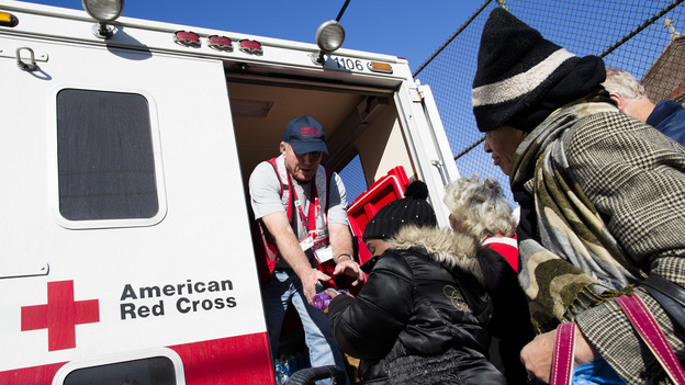 A member of the Red Cross distributes food to residents of Coney Island affected by Superstorm Sandy in the Brooklyn, N.Y., on Nov. 9.