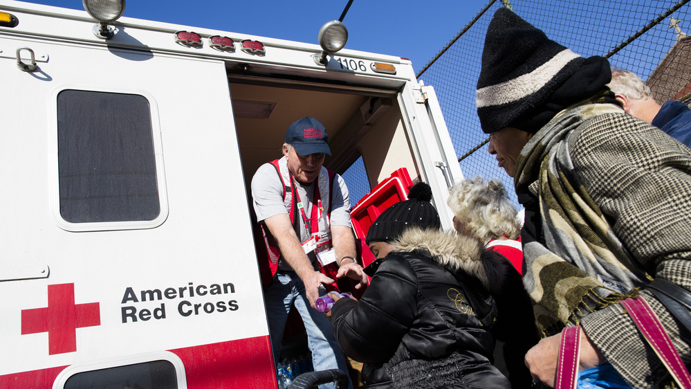 A member of the Red Cross distributes food to residents of Coney Island affected by Superstorm Sandy in the Brooklyn, N.Y., on Nov. 9.