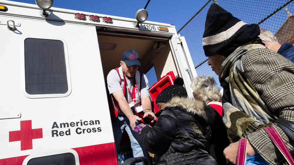 A member of the Red Cross distributes food to residents of Coney Island affected by Superstorm Sandy in the Brooklyn, N.Y., on Nov. 9.