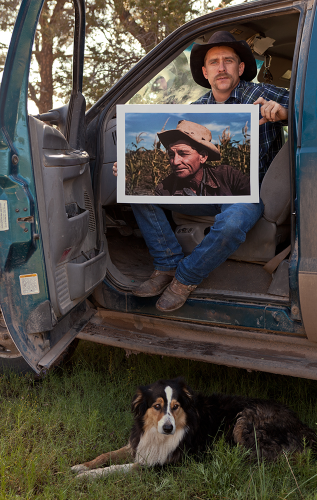 Rex Collins Norris Jr., holding the photo of his grandfather taken by Russel Lee