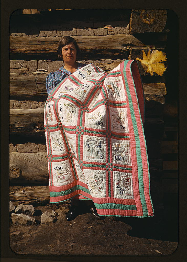 Mrs. Bill Stagg with state quilt, 1940