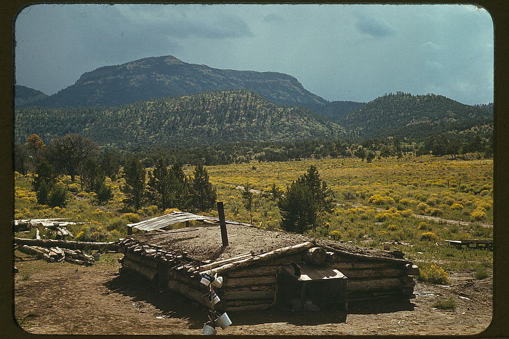 Dugout house of Faro Caudill, homesteader, with Mount Allegro in the background, 1940