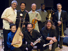 Burning Bridge personnel, left to right: Jason Kao Hwang (violin), Wang Guowei (erhu), Sun Li (pipa), Ken Filiano (string bass), Andrew Drury (drum set), Joseph Daley (tuba), Steve Swell (trombone), Taylor Ho Bynum (cornet/flugelhorn). Burning Bridge personnel, left to right: Jason Kao Hwang (violin), Wang Guowei (erhu), Sun Li (pipa), Ken Filiano (string bass), Andrew Drury (drum set), Joseph Daley (tuba), Steve Swell (trombone), Taylor Ho Bynum (cornet/flugelhorn).