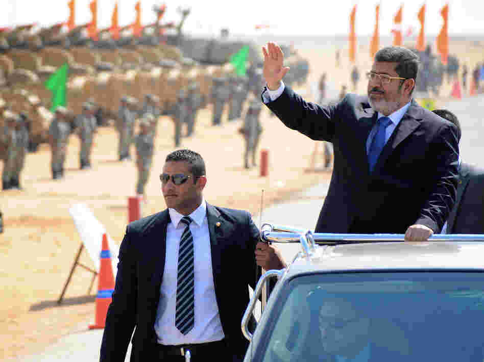 Egyptian President Mohammed Morsi waves at soldiers at a military base in Ismailia, Egypt, in October. Morsi's recent decrees have angered judges who are planning to strike. Egyptian President Mohammed Morsi waves at soldiers at a military base in Ismailia, Egypt, in October. Morsi's recent decrees have angered judges who are planning to strike.
