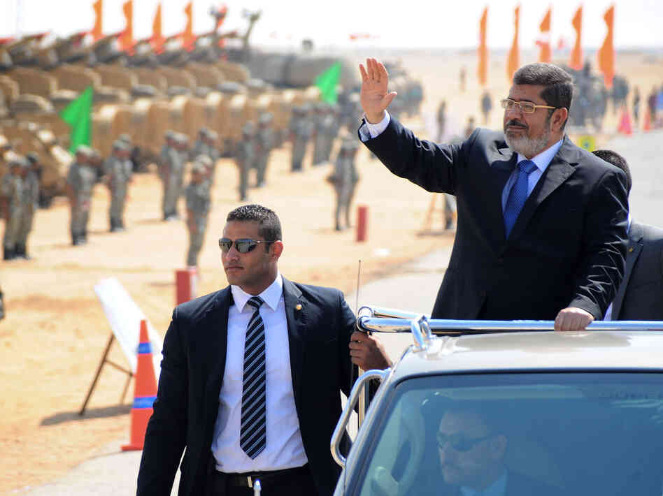 Egyptian President Mohammed Morsi waves at soldiers at a military base in Ismailia, Egypt, in October. Morsi's recent decrees have angered judges who are planning to strike. Egyptian President Mohammed Morsi waves at soldiers at a military base in Ismailia, Egypt, in October. Morsi's recent decrees have angered judges who are planning to strike.