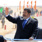 Egyptian President Mohammed Morsi waves at soldiers at a military base in Ismailia, Egypt, in October. Morsi's recent decrees have angered judges who are planning to strike.
