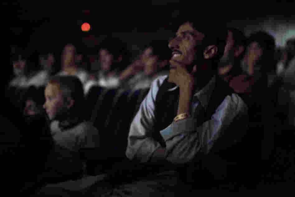 The audience at Pamir Cinema in Kabul watches a Pakistani film.