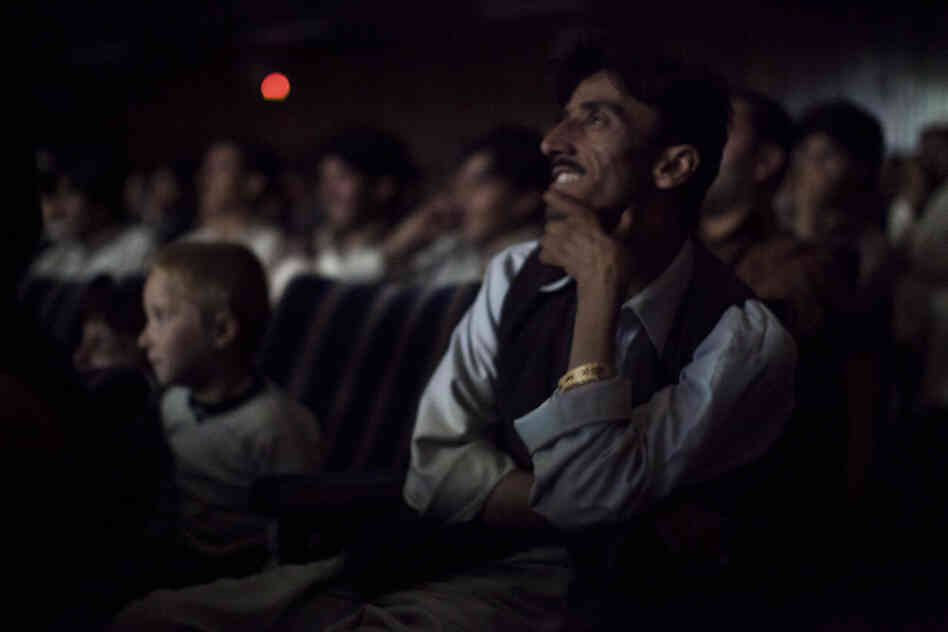 The audience at Pamir Cinema in Kabul watches a Pakistani film.
