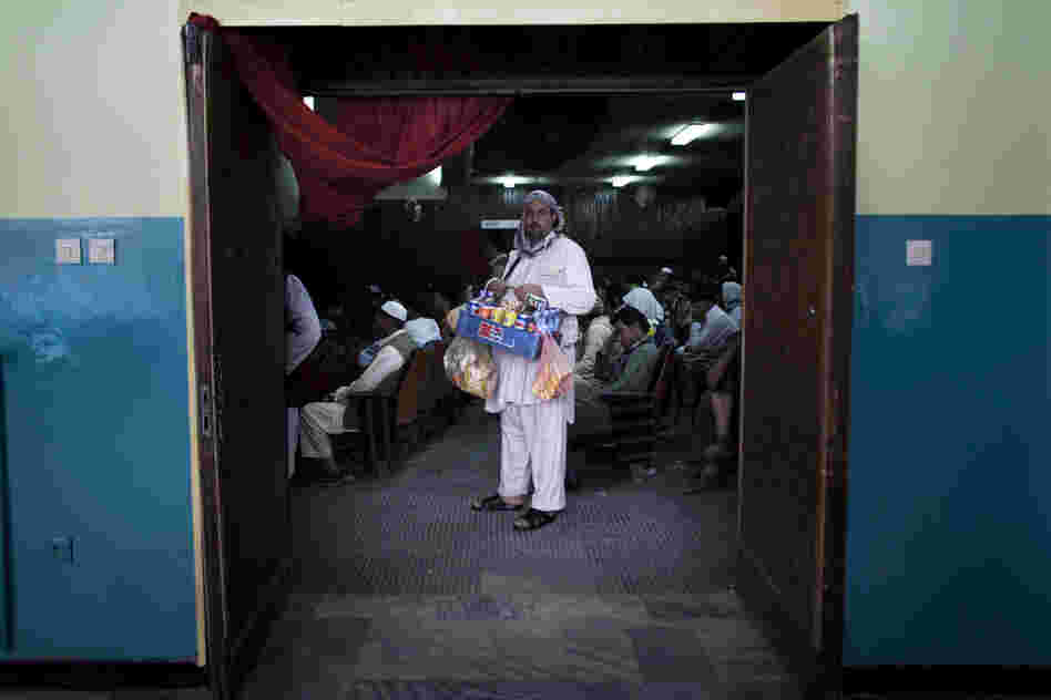 A concessions vendor at work in Pamir Cinema.