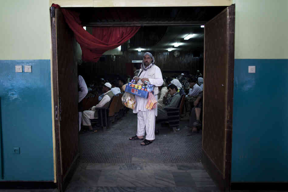 A concessions vendor at work in Pamir Cinema.