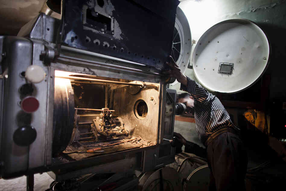 A projectionist at work at Temorshahee Cinema in Kabul.