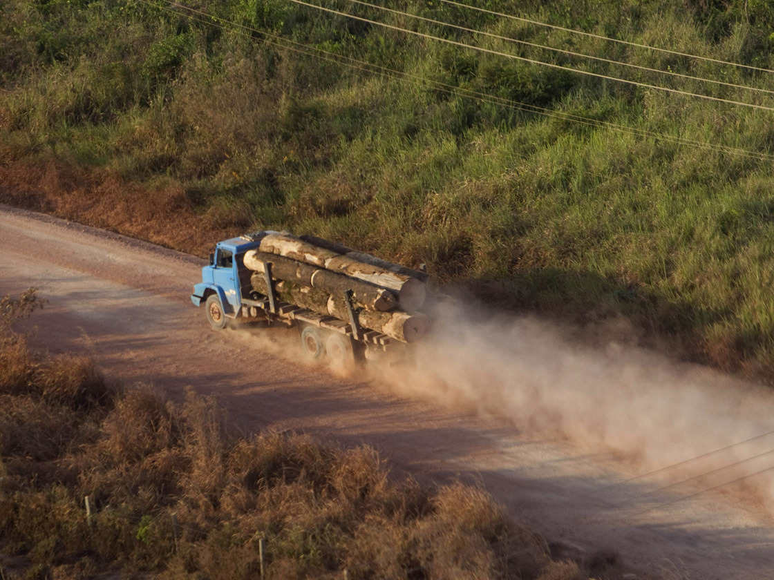 A truck carrying hardwood timber drives along a rural road leading to Paragominas, Brazil, on Sept. 23, 2011. The city has become a pioneering "Green City," a model of sustainability with a new economic approach that has seen illegal deforestation virtually halted.