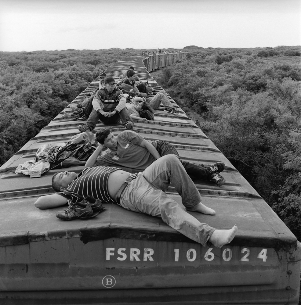 Undocumented Central American migrants ride a freight train through the southern Mexican state of Oaxaca during the first leg of the journey by rail to the U.S. border. July 2010.