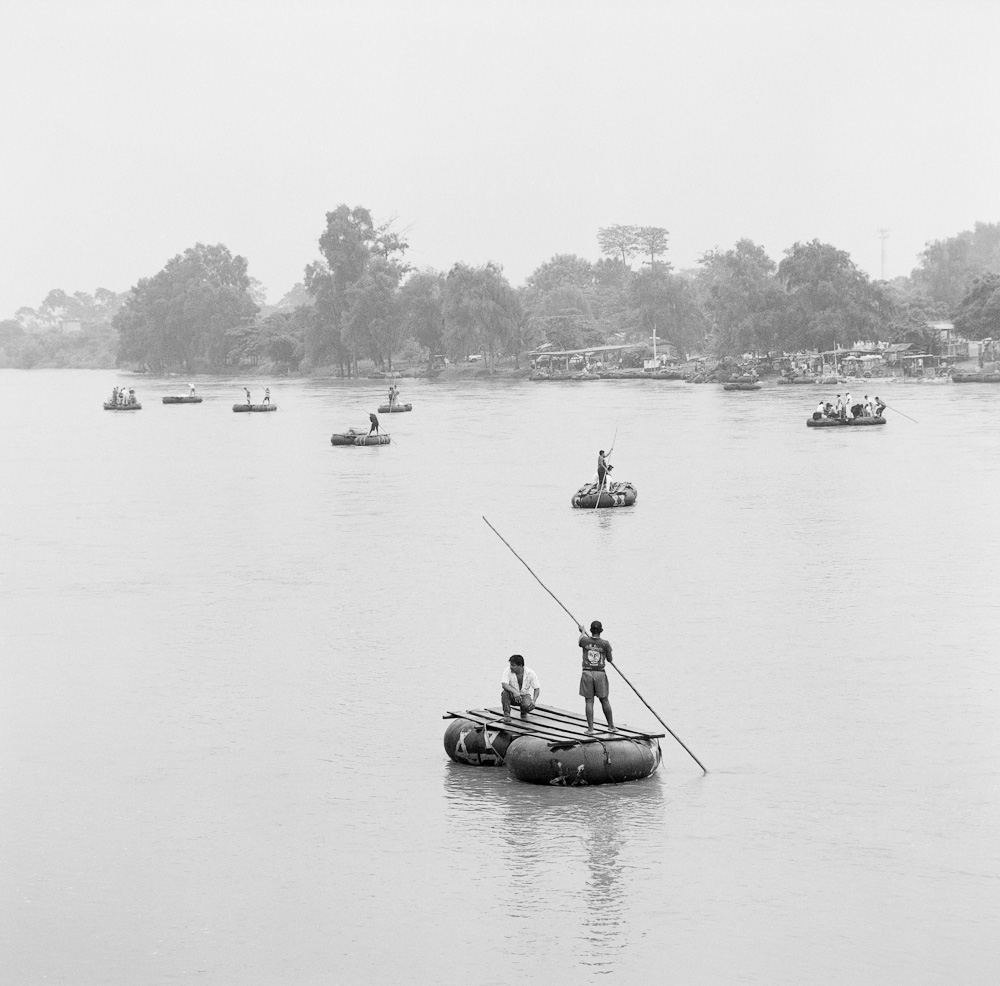 Rafts made of tractor tires ferry contraband goods and undocumented migrants across the Suchiate River running between the Guatemalan border town of Tecun Uman and the Mexican town of Hidalgo, in the state of Chiapas. June 2009.