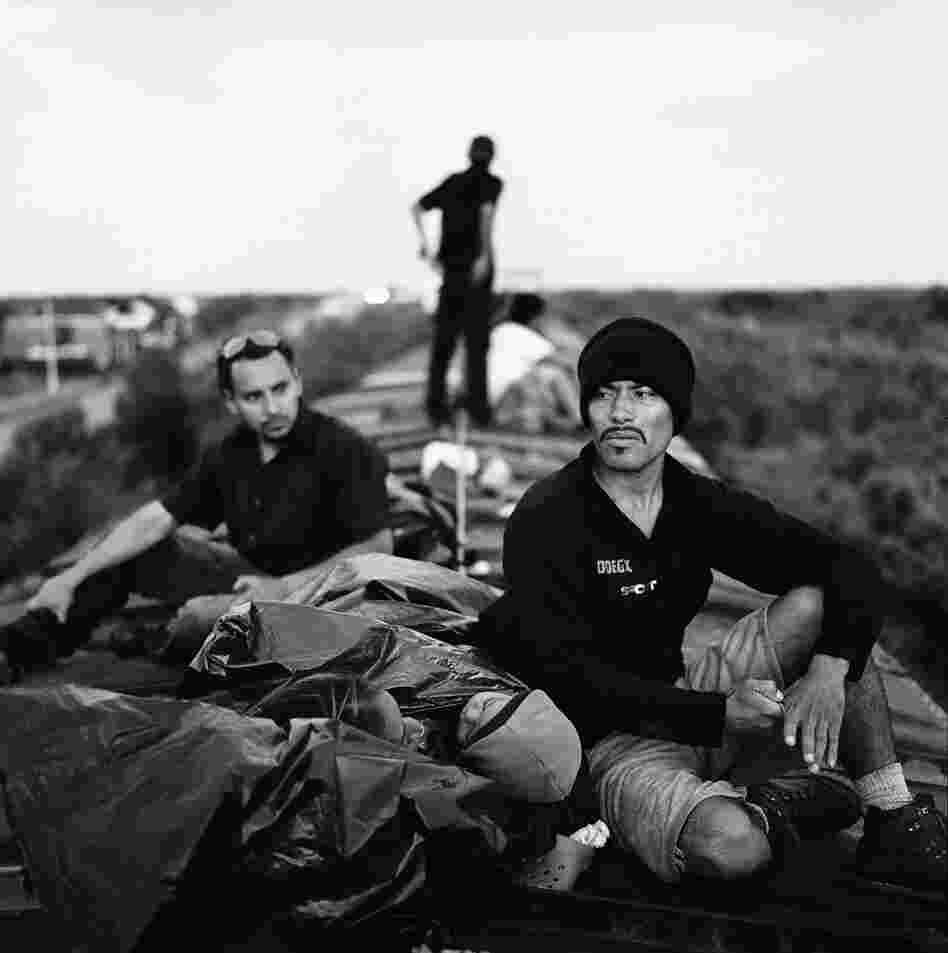 A Salvadoran man, his wife and his 18-month-old son ride a train through Oaxaca. July 2010.