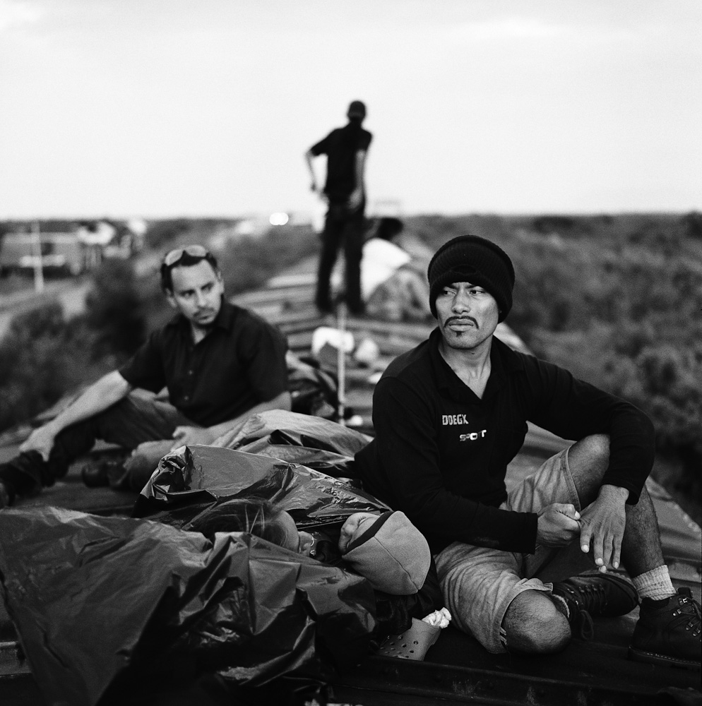 A Salvadoran man, his wife and his 18-month-old son ride a train through Oaxaca. July 2010.