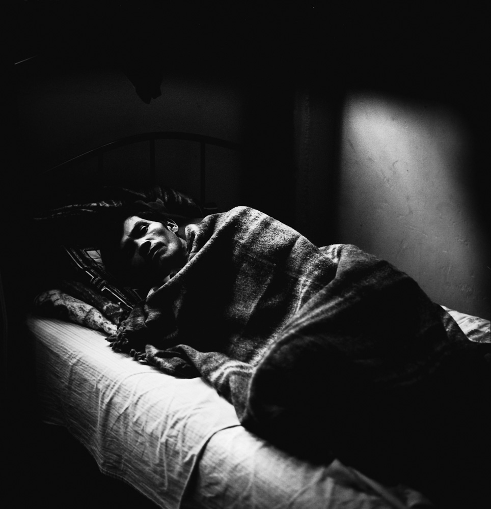 A Salvadoran migrant, whose foot was cut in half when it got caught between two boxcars, recuperates from his injuries at the San Juan Diego migrant shelter on the outskirts of an industrial neighborhood called Lecheria in Mexico City. July 2010.