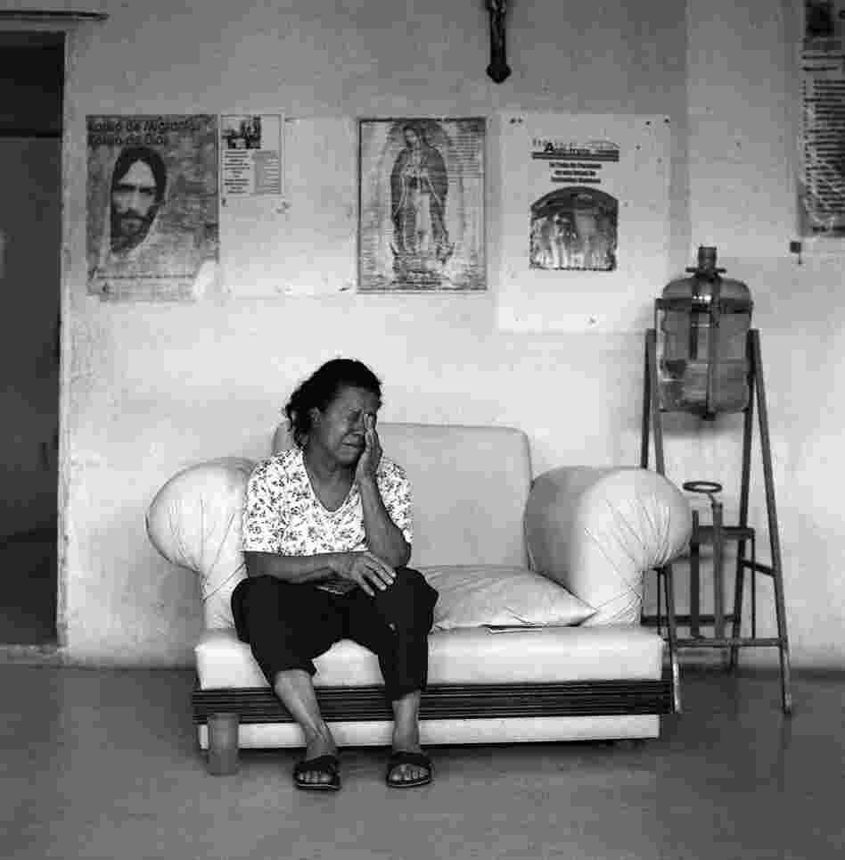 A frightened Honduran migrant who became separated from her husband when he was apprehended and detained by Mexican immigration officials seeks refuge at the Home of Mercy migrant shelter in the town of Arriaga. June 2009.