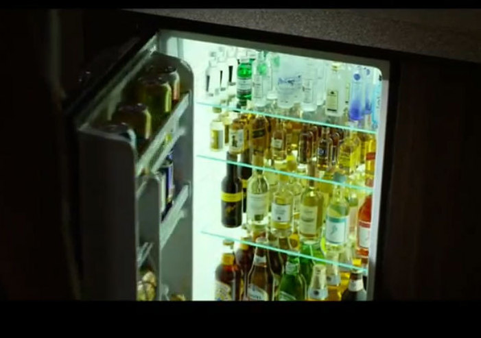 A screenshot from the trailer of <em>Flight</em>, showing the fully stocked (some would say too fully stocked) minibar.