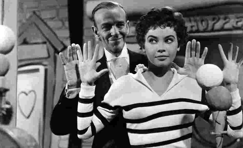 In 1955's Daddy Long Legs, Leslie Caron plays a French orphan who goes to college thanks to help from an anonymous, American benefactor (Fred Astaire). In 1955's Daddy Long Legs, Leslie Caron plays a French orphan who goes to college thanks to help from an anonymous, American benefactor (Fred Astaire).