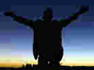 A foreign tourist prays to god during a solar eclipse in Galo, Libya in March 2006. A foreign tourist prays to god during a solar eclipse in Galo, Libya in March 2006.