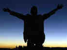 A foreign tourist prays to god during a solar eclipse in Galo, Libya in March 2006. A foreign tourist prays to god during a solar eclipse in Galo, Libya in March 2006.