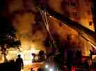 Firefighters attack a factory fire near Dhaka, Bangladesh on Saturday, Nov. 24. More than 100 people were killed in the blaze.