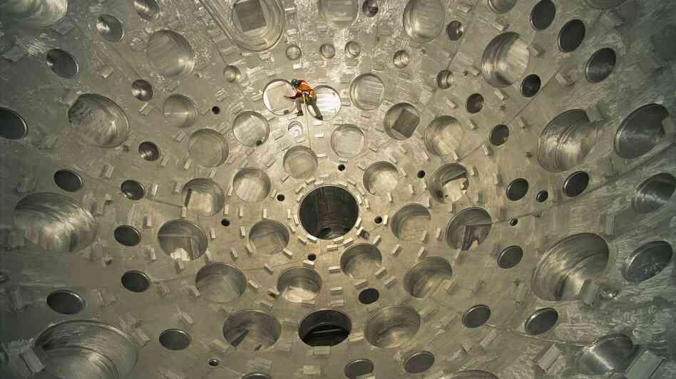 A worker inspects a huge target chamber at the National Ignition Facility in California, in 2001, where beams from 192 lasers are aimed at a pellet of fusion fuel in the hopes of creating nuclear fusion. A worker inspects a huge target chamber at the National Ignition Facility in California, in 2001, where beams from 192 lasers are aimed at a pellet of fusion fuel in the hopes of creating nuclear fusion.