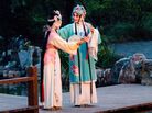 A garden serves as the stage in the opera. A garden serves as the stage in the opera.