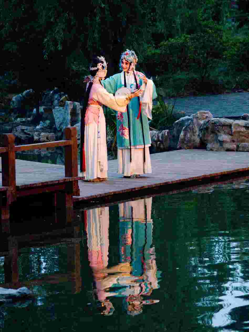 A garden serves as the stage in the opera.