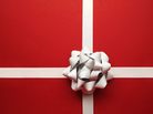 Simple red gift wrap with a silver bow. Simple red gift wrap with a silver bow.