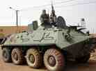 Fighters of the Islamist group, the Movement for Oneness and Jihad in West Africa guard a tank abandoned by the Malian army on Aug. 7. Fighters of the Islamist group, the Movement for Oneness and Jihad in West Africa guard a tank abandoned by the Malian army on Aug. 7.
