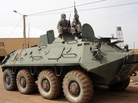 Fighters of the Islamist group, the Movement for Oneness and Jihad in West Africa guard a tank abandoned by the Malian army on Aug. 7. Fighters of the Islamist group, the Movement for Oneness and Jihad in West Africa guard a tank abandoned by the Malian army on Aug. 7.