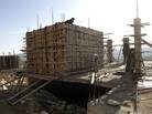 Workers construct new houses in the Jewish settlement of Shilo in the West Bank, back in February. Workers construct new houses in the Jewish settlement of Shilo in the West Bank, back in February.
